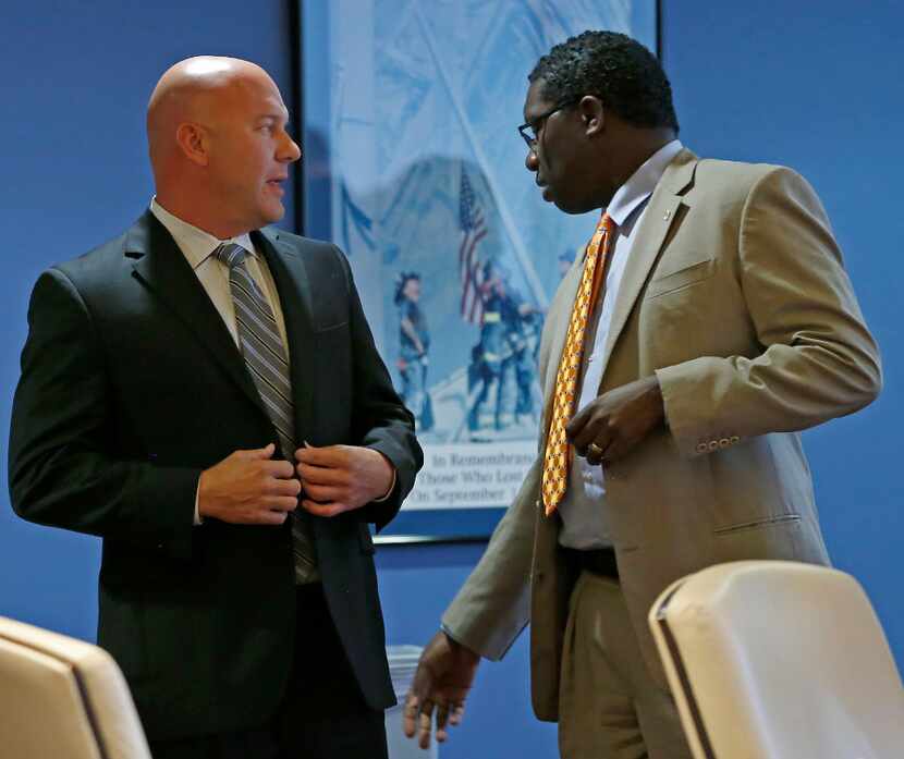 Brian Hass (left),  DallasFire-Rescue Dept., talks with City Council member Erik Wilson...