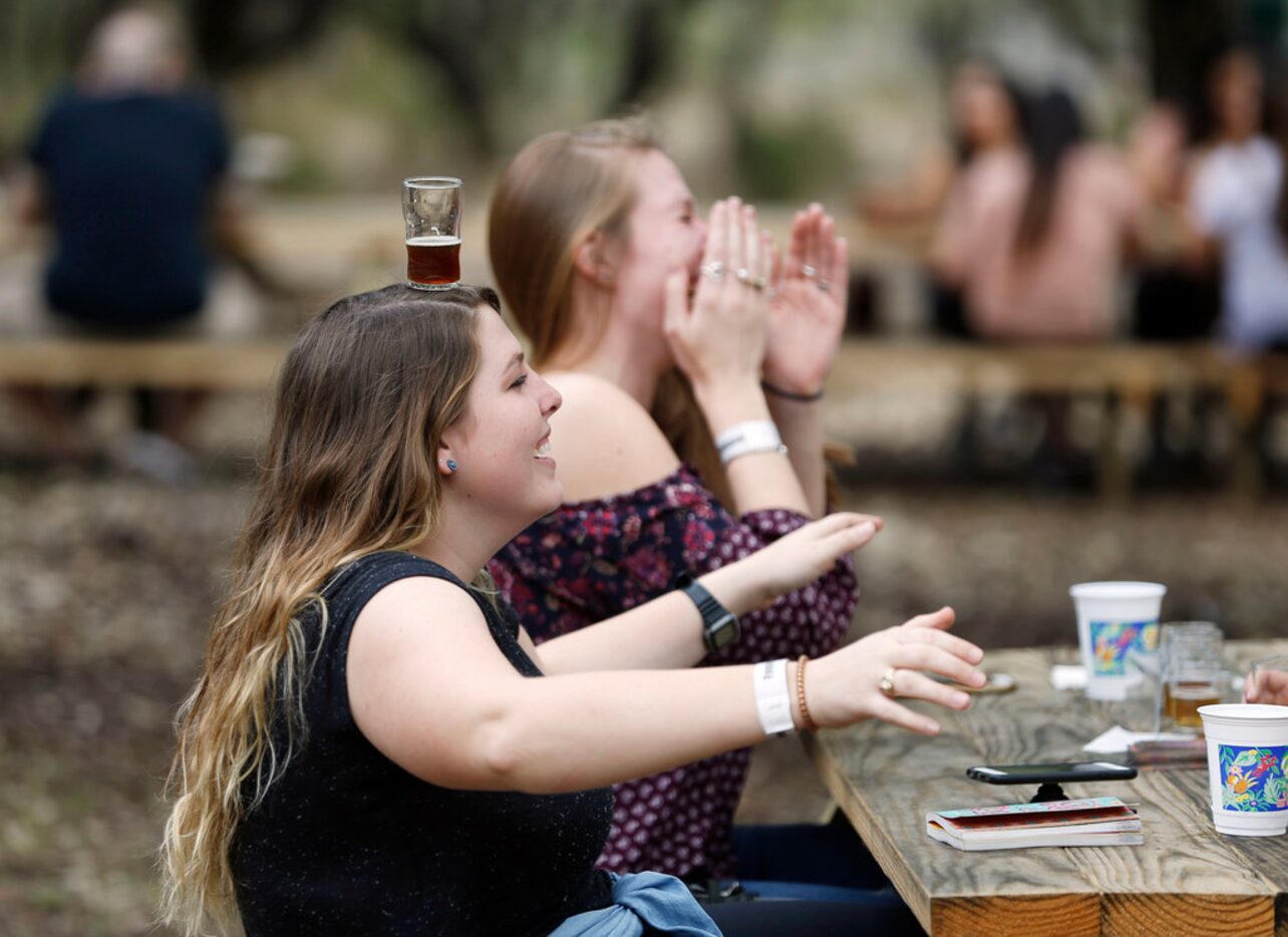 Baileigh Millender of Rockwall, Texas balances a glass on her head as Caroline Kimbell of...