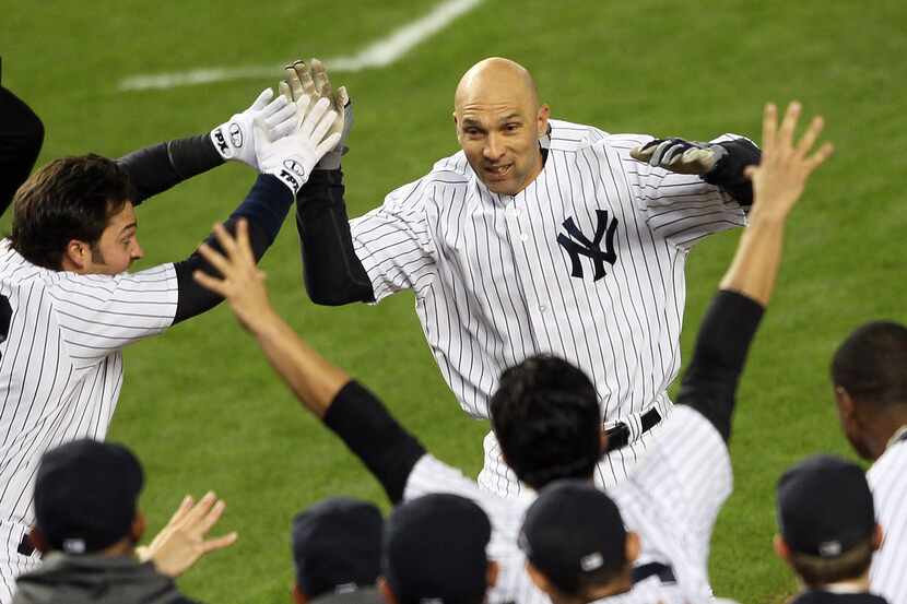 NEW YORK, NY - OCTOBER 10:  Raul Ibanez #27 of the New York Yankees reacts after hitting a...