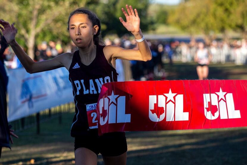 Plano's Ashlyn Hillyard finishes first in the girls 6A UIL State Cross Country Championship...