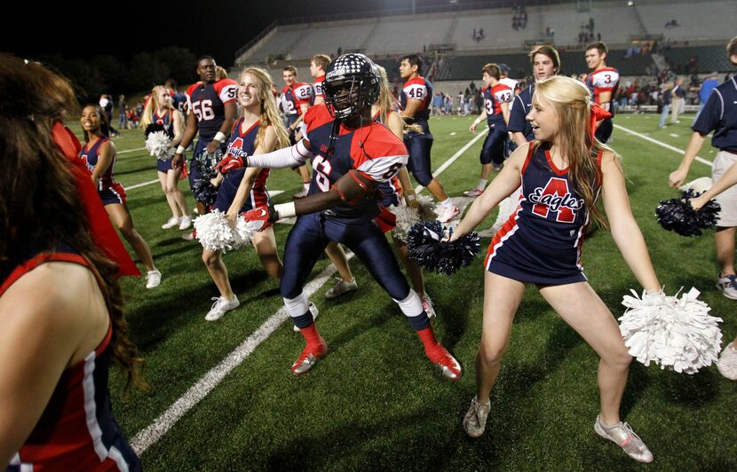 Allen's Kendall Clinton (6) dances with the cheerleaders after they defeated Skyline in the...