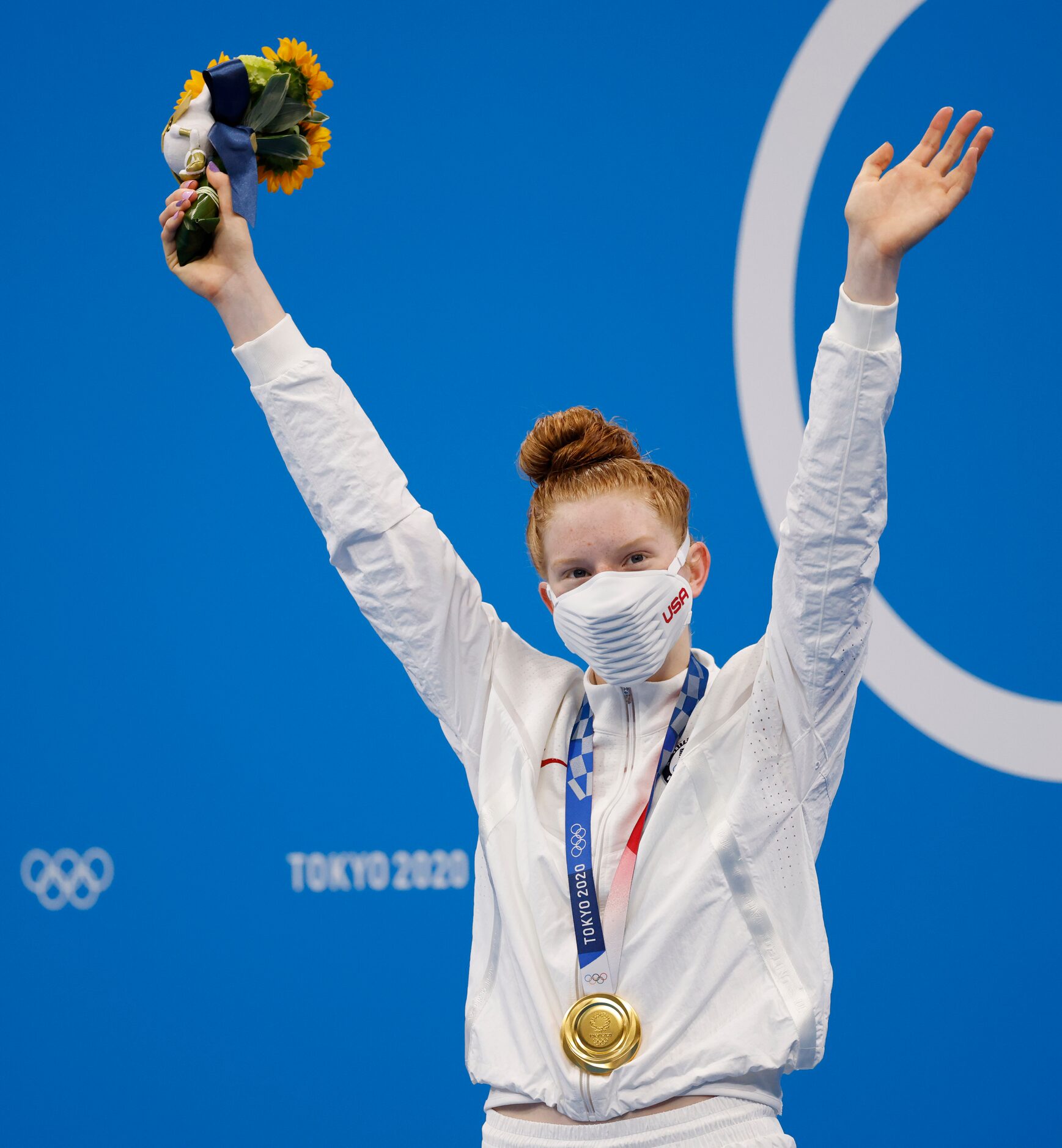 USA’s Lydia Jacoby celebrates after receiving her gold medal during the medal ceremony for...