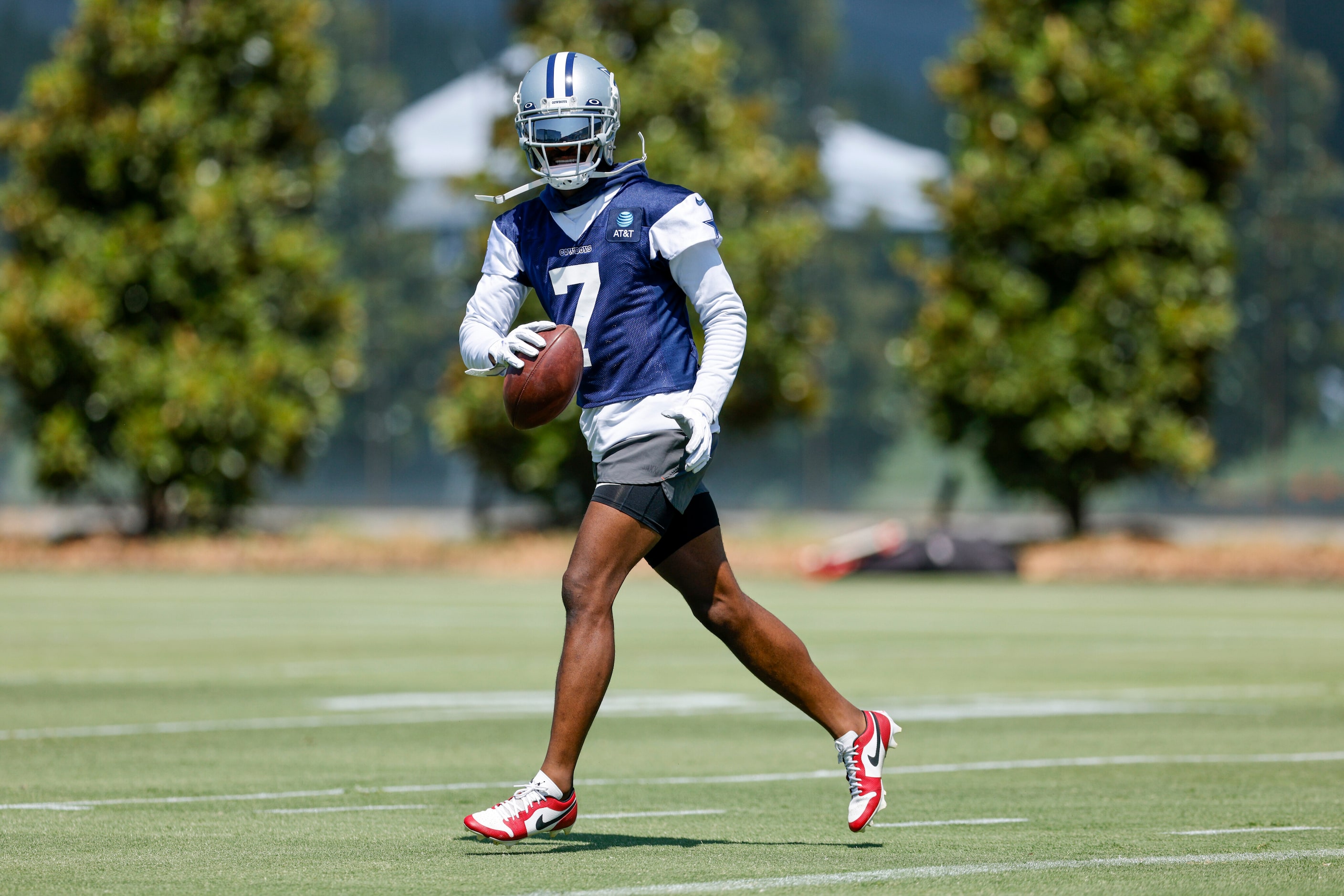 Dallas Cowboys cornerback Trevon Diggs (7) runs with a ball during a practice at The Star,...