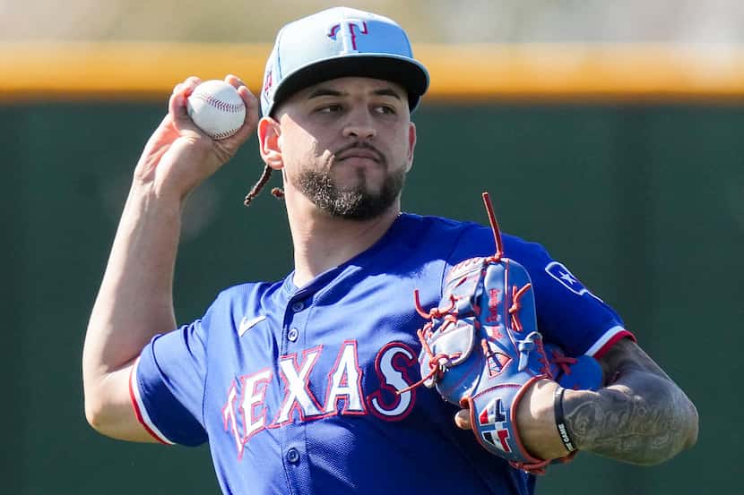 Texas Rangers pitcher Yerry Rodríguez throws in the outfield during a spring training...