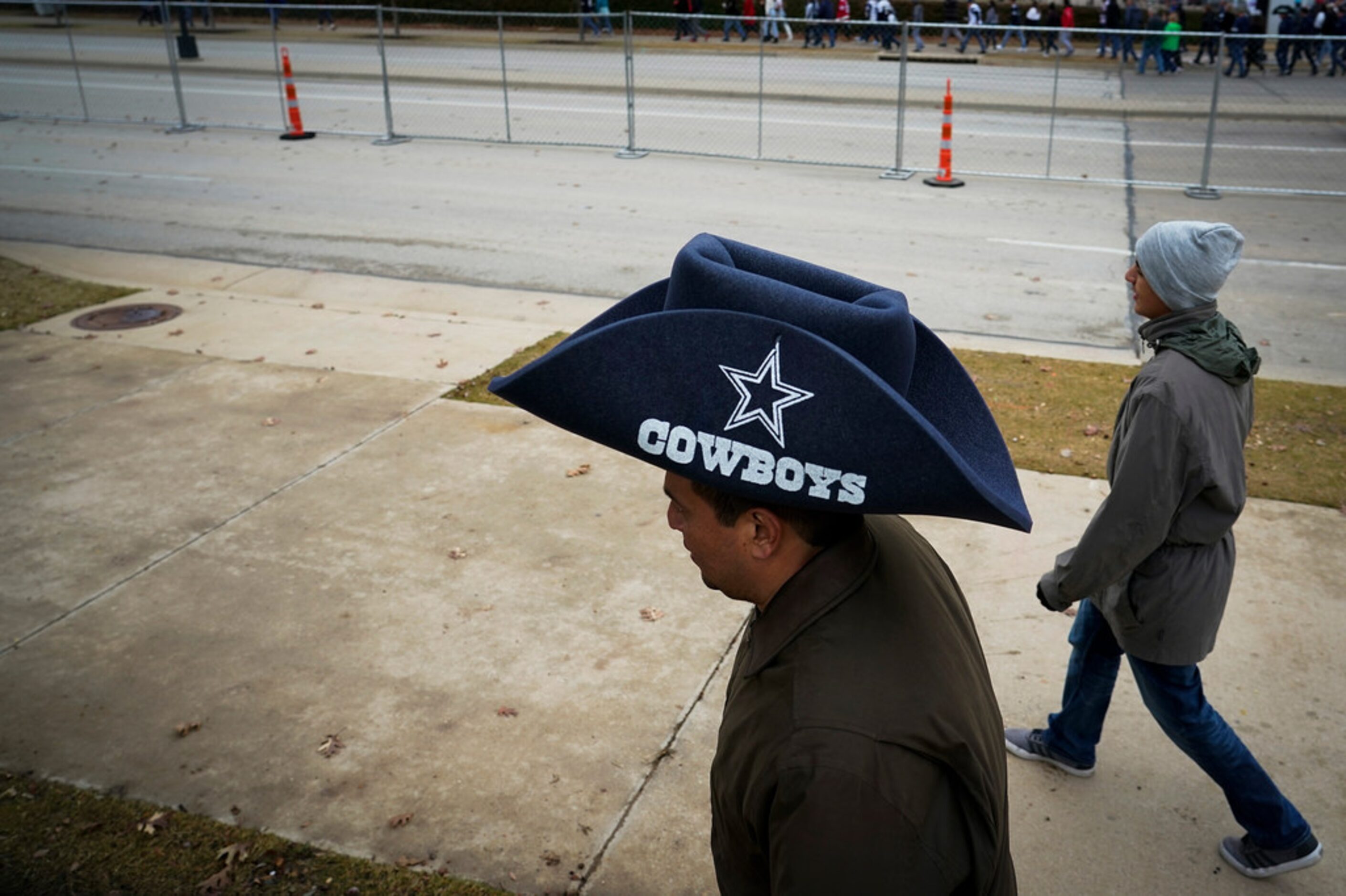 Fans head to the stadium before an NFL football game between the Dallas Cowboys and the...