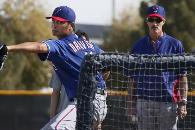 Texas pitcher Yu Darvish throws batting practice during Texas Rangers baseball spring...