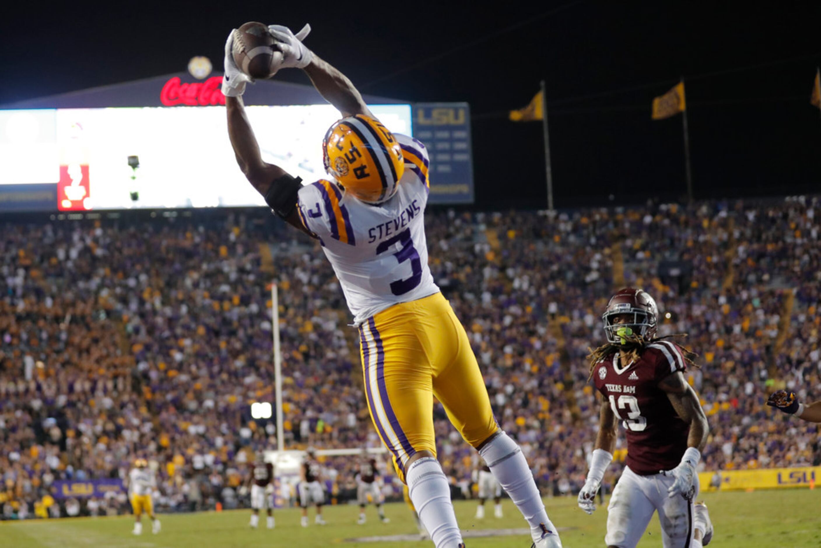 LSU safety JaCoby Stevens (3) pulls in an interception in the end zone on a pass intended...