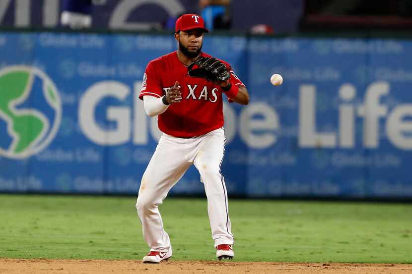 Texas Rangers shortstop Elvis Andrus (1) fields a ground out by Boston Red Sox' Mitch...