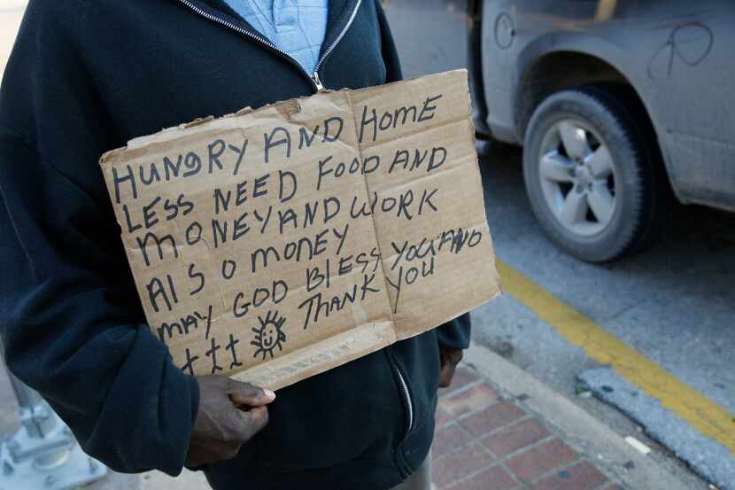 Fifty-one-year-old Larry Harris was panhandling Monday along Interstate 35E near Oak Lawn...