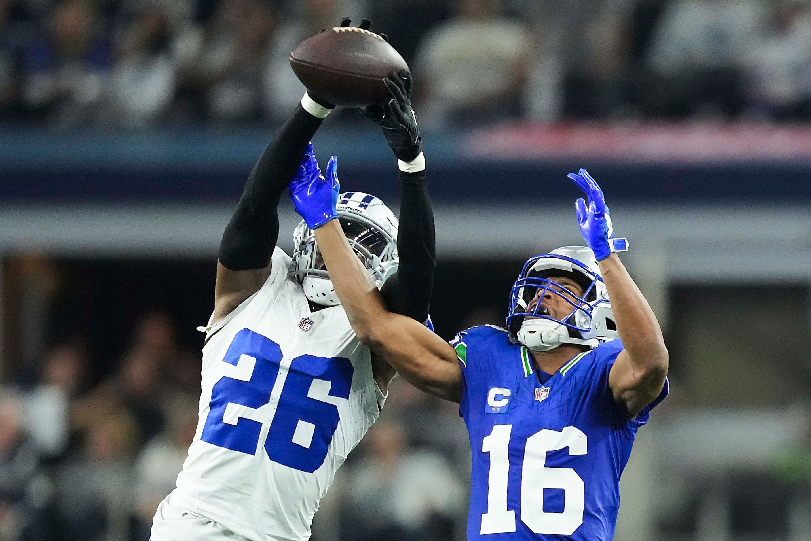 Dallas Cowboys cornerback DaRon Bland (26) intercepts a pass intended for Seattle Seahawks...