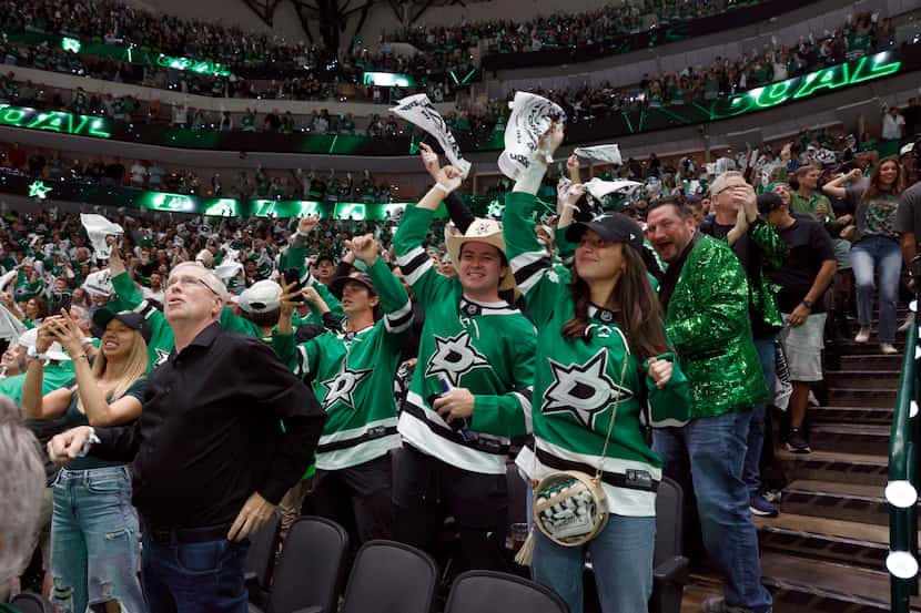 Dallas Stars fans celebrate a goal by left wing Mason Marchment during the third period of...