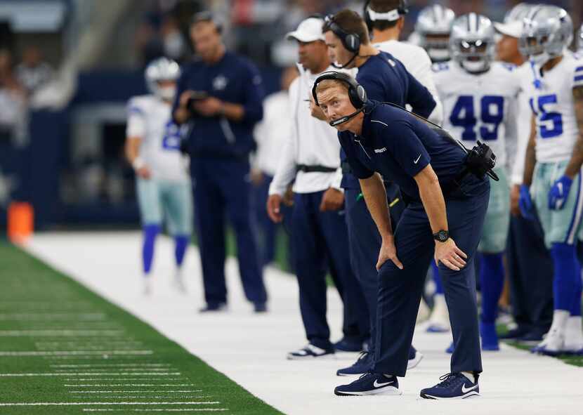 Dallas Cowboys head coach Jason Garrett looks up toward the scoreboard during the second...