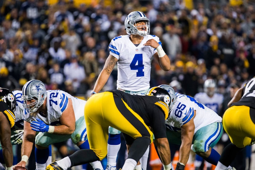 Dallas Cowboys quarterback Dak Prescott (4) signals a play during the fourth quarter of...