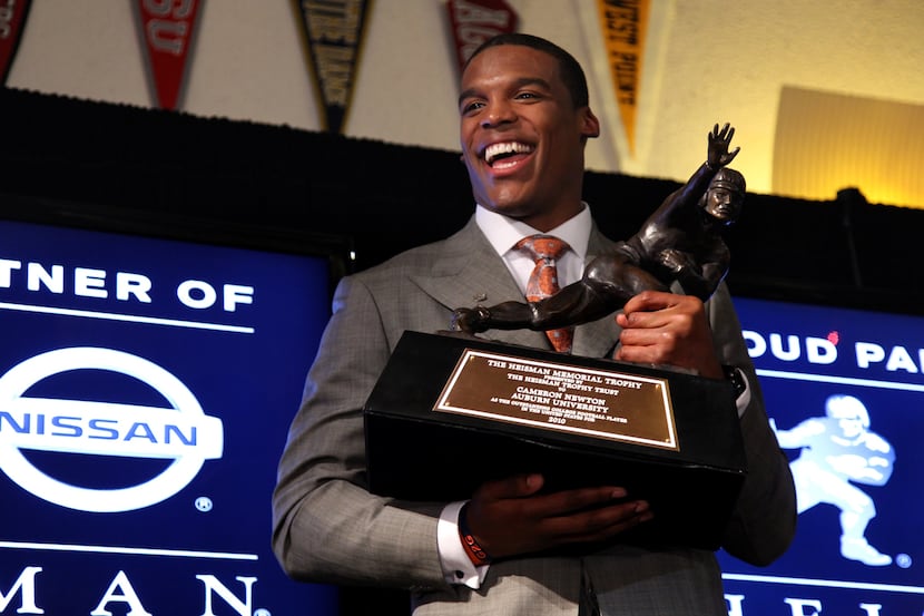 Auburn quarterback  Cam  Newton reacts during a news conference after winning the Heisman...