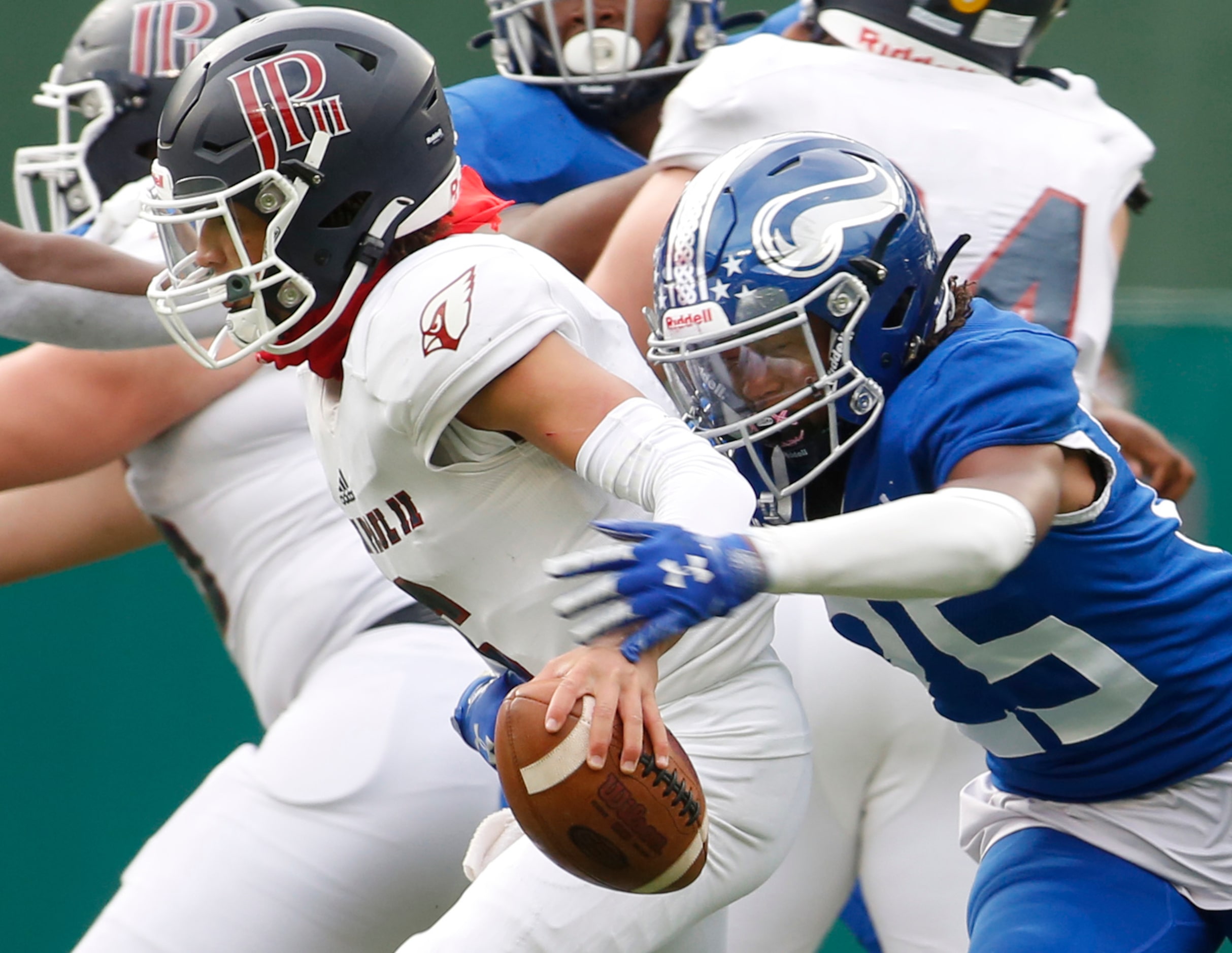 Plano John Paul ll quarterback Chase Washington (6) is unable to elude the pressure from...