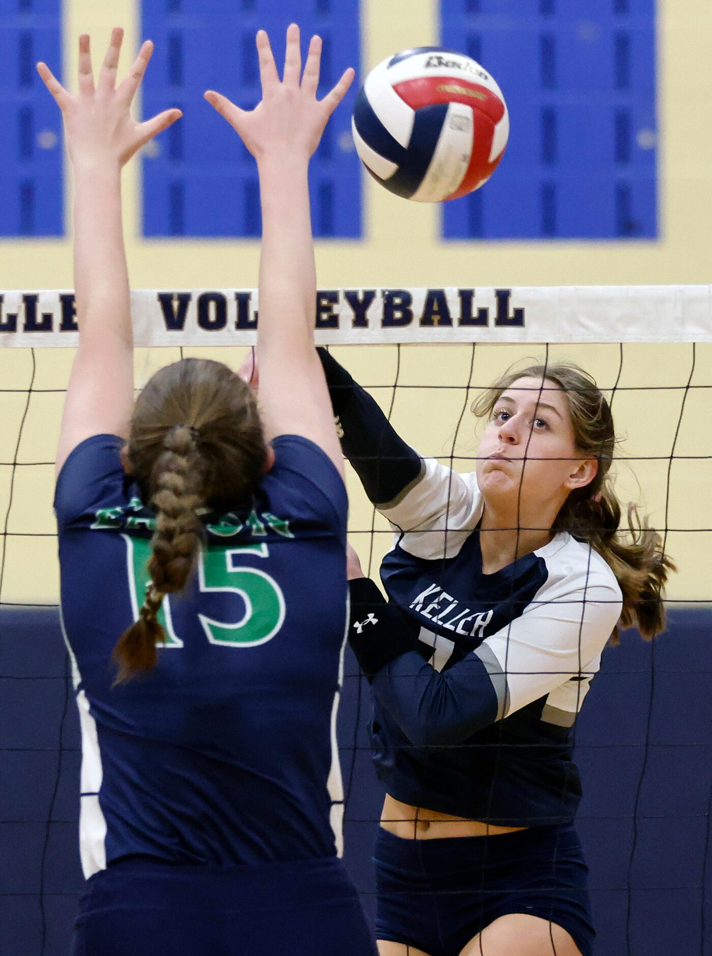 Keller High’s Reagan Sharp (7) spikes the ball past Eaton High’s Angela Boaz (15) during the...