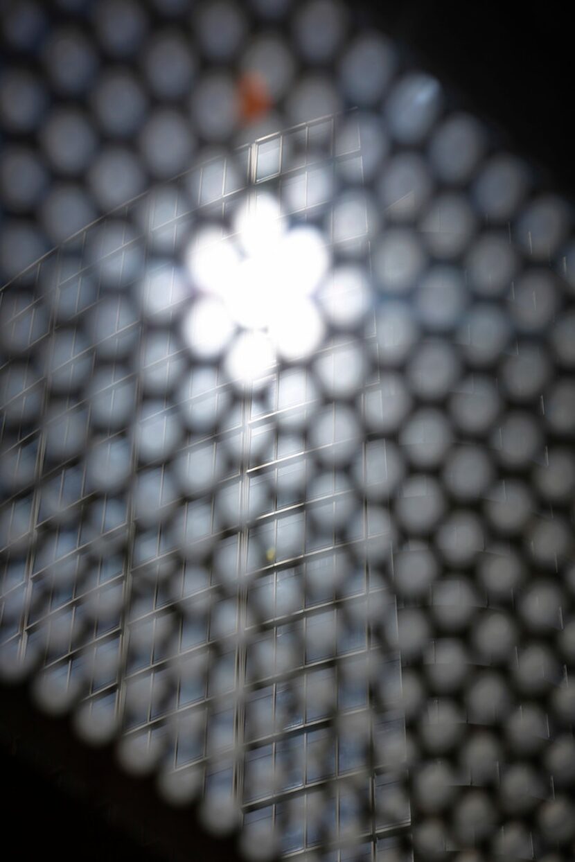 The reflected sun comes through the oculi (small circles) in the roof that were designed to...