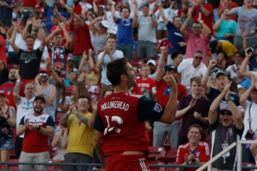 FC Dallas defenseman Ryan Hollingshead (12) pumps his fist as he energized fans after his...
