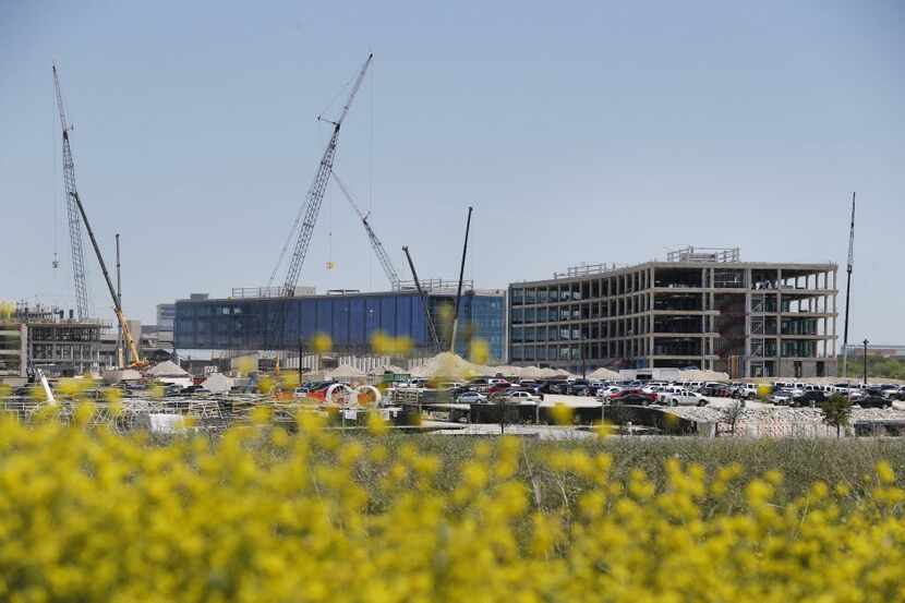  Construction costs at Toyota's new North American headquarters in Plano and other expenses...