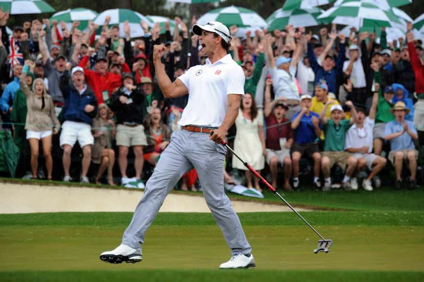 Adam Scott of Australia celebrates on the 18th hole to force a playoff during the fourth...