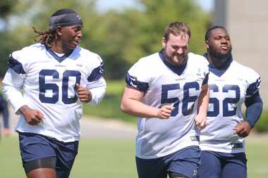 Dallas Cowboys offensive line Tyler Guyton (60) and Cooper Beebe (56), and Nathan Thomas...