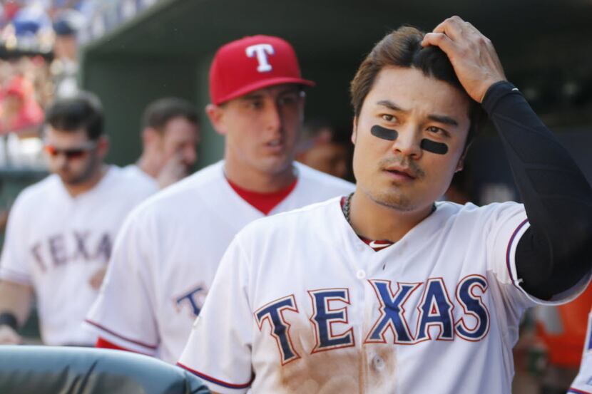 Texas Rangers Shin-Soo Choo, Derek Holland and Mitch Moreland, right to left, are pictured...