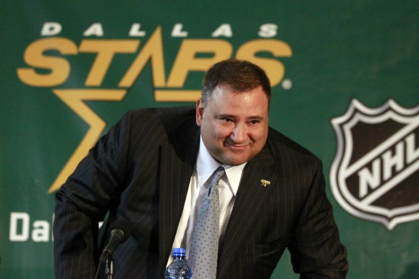 Tom Gaglardi gets up as he is introduced as the new owner of the Dallas Stars during a news...