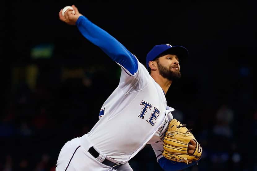 ARLINGTON, TX - APRIL 14:  Nick Martinez #22 of the Texas Rangers pitches against the Los...