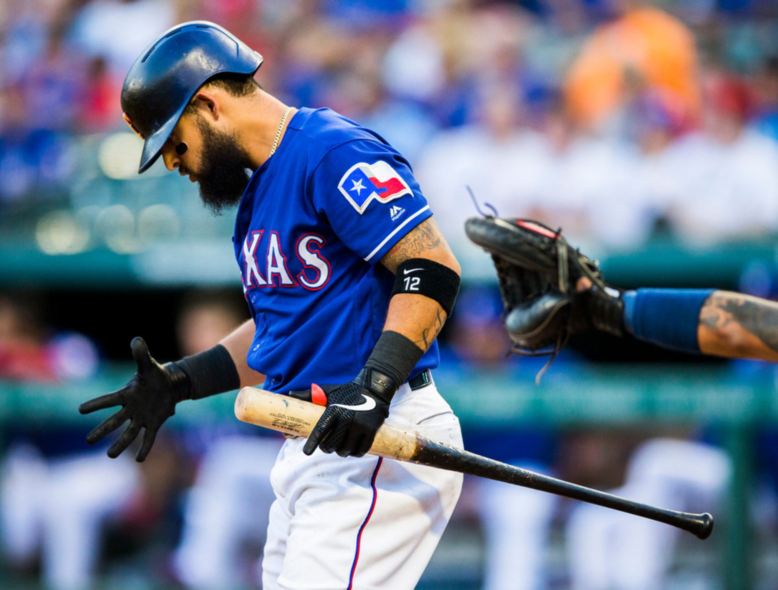 Texas Rangers second baseman Rougned Odor (12) reacts to a strike during the second inning...