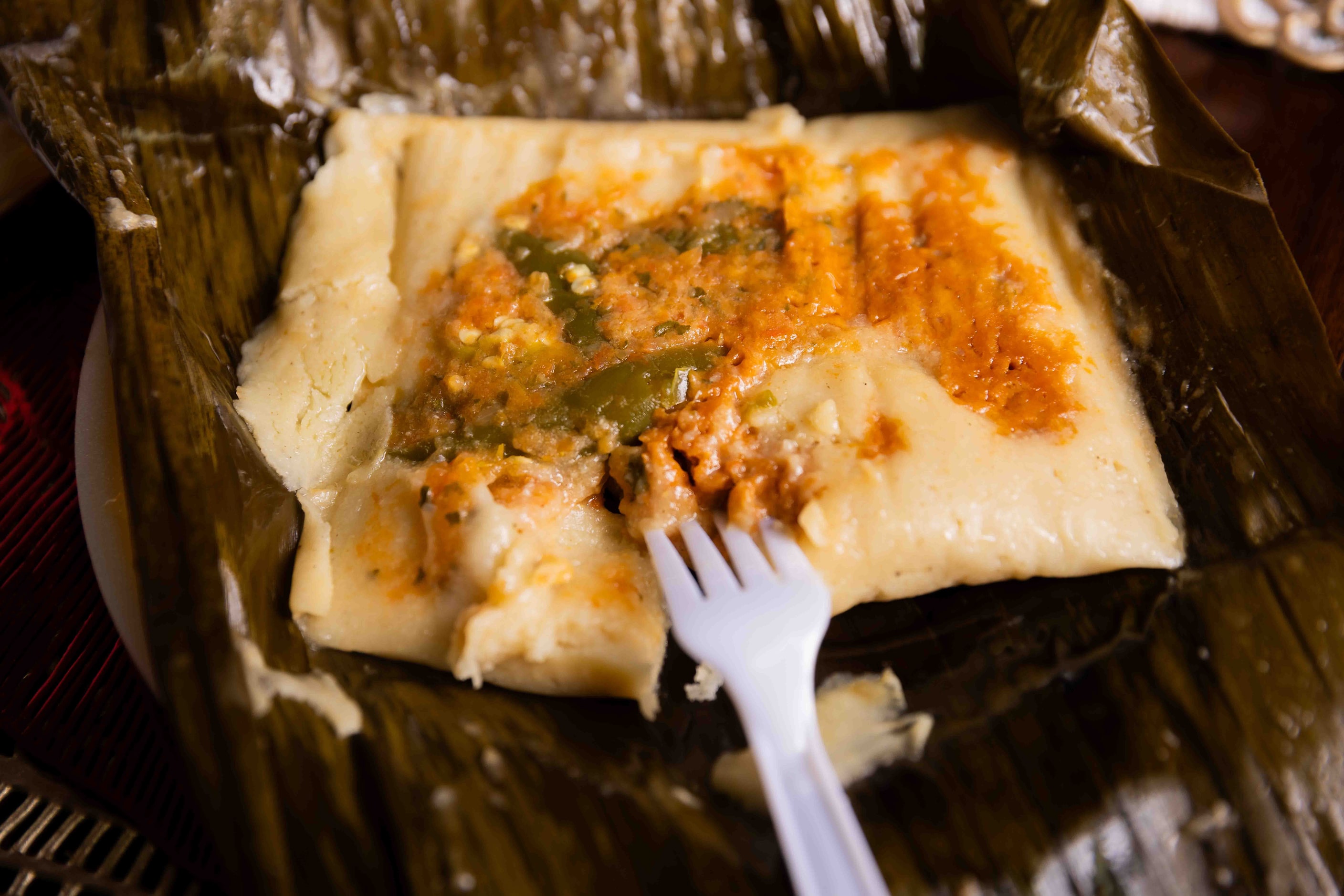 A rajas tamale cooked in a banana leaf made by Sara Klein (not pictured), the hostess behind...