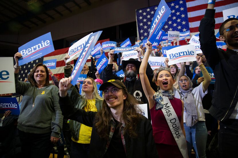 Fans -- including SMU law student Averie Bishop, right, who is Miss Dallas 2020 -- cheer as...