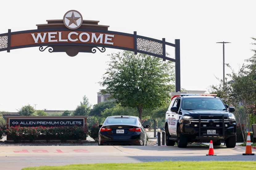 Allen police remain outside the north entrance of Allen Premium Outlets mall on Wednesday,...