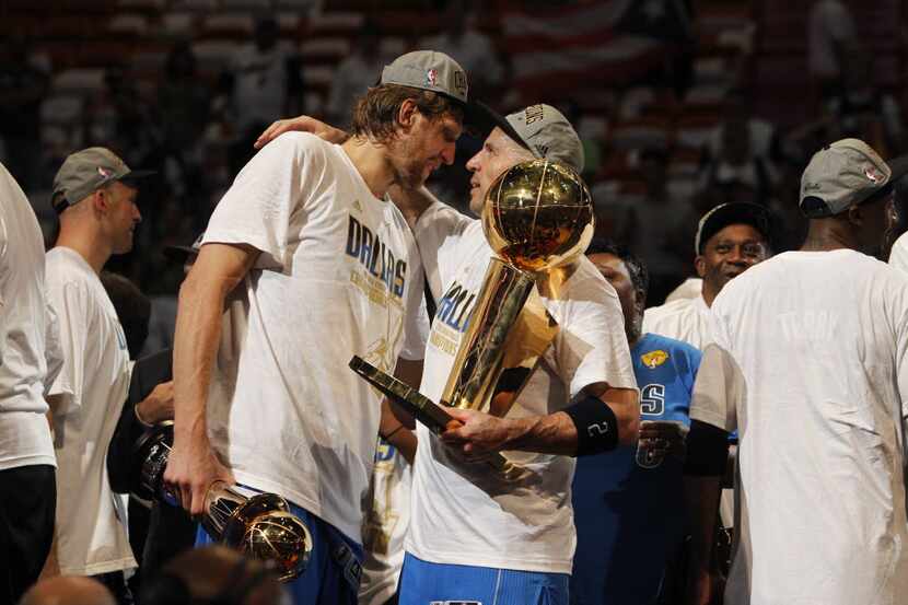 Dallas Mavericks power forward Dirk Nowitzki (41), holding the Bill Russell NBA Finals MVP...