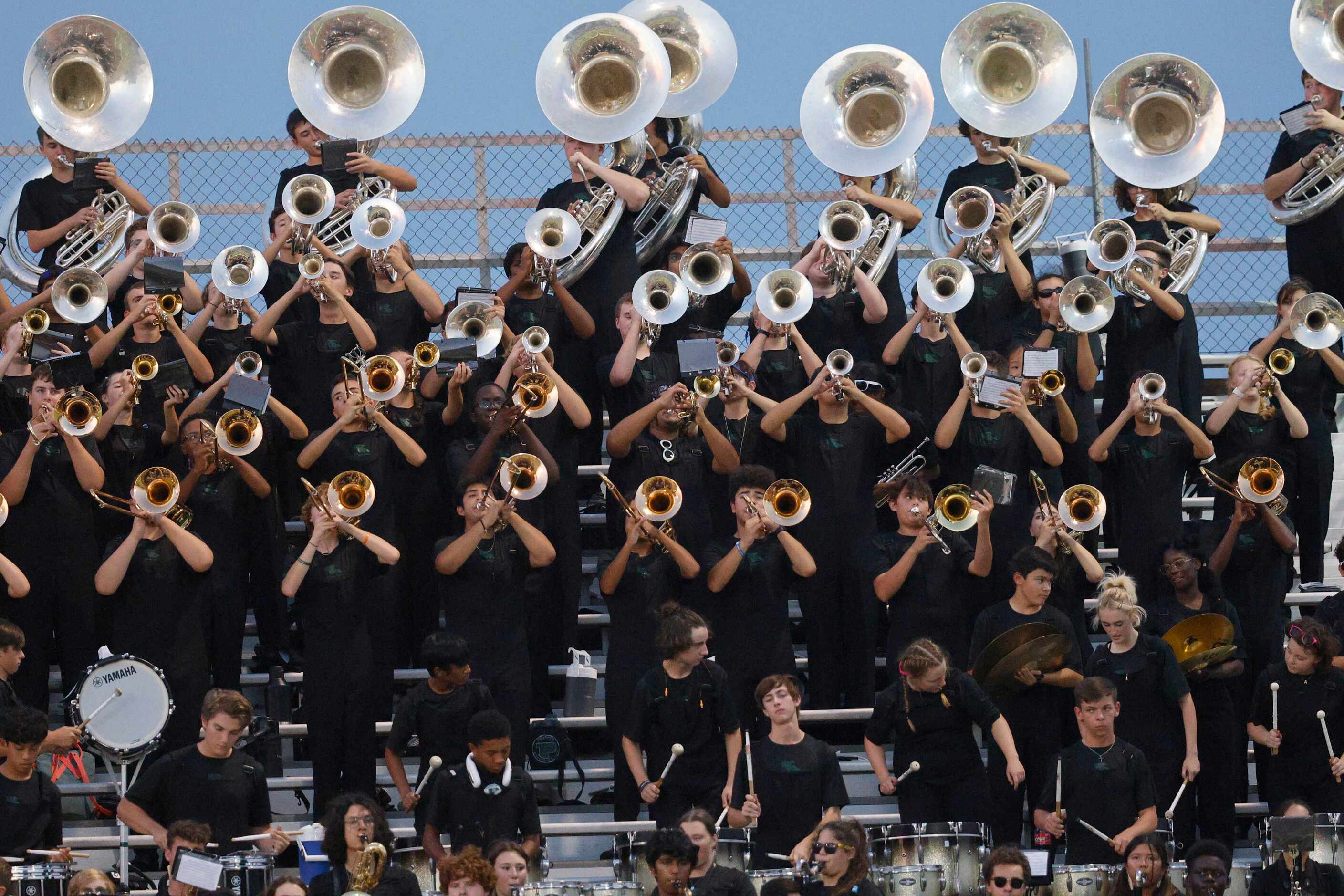 Prosper High School Mighty Eagle Marching Band performs during the first half of a high...
