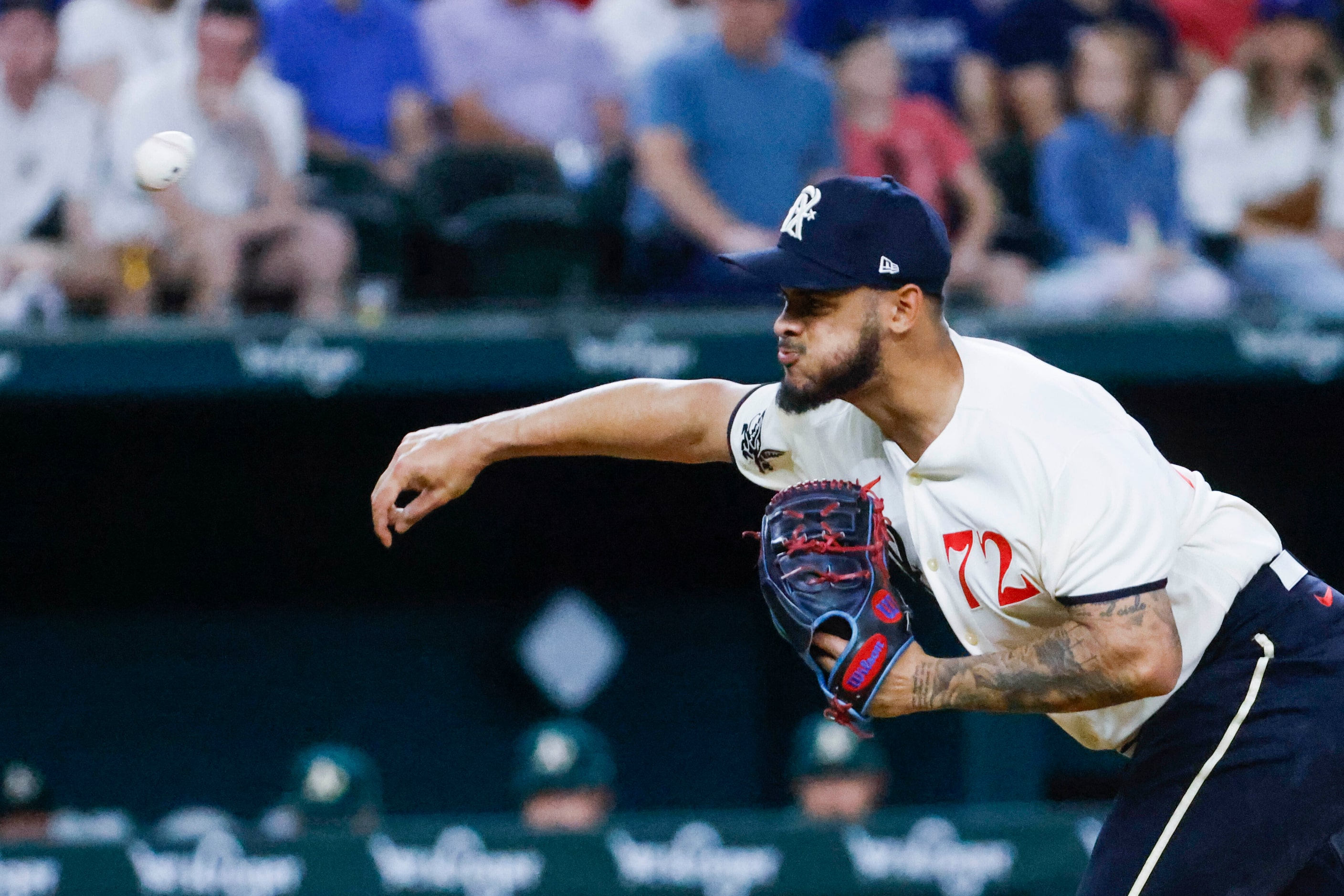 Texas Rangers relief pitcher Jonathan Hernandez throw during a baseball game against Oakland...