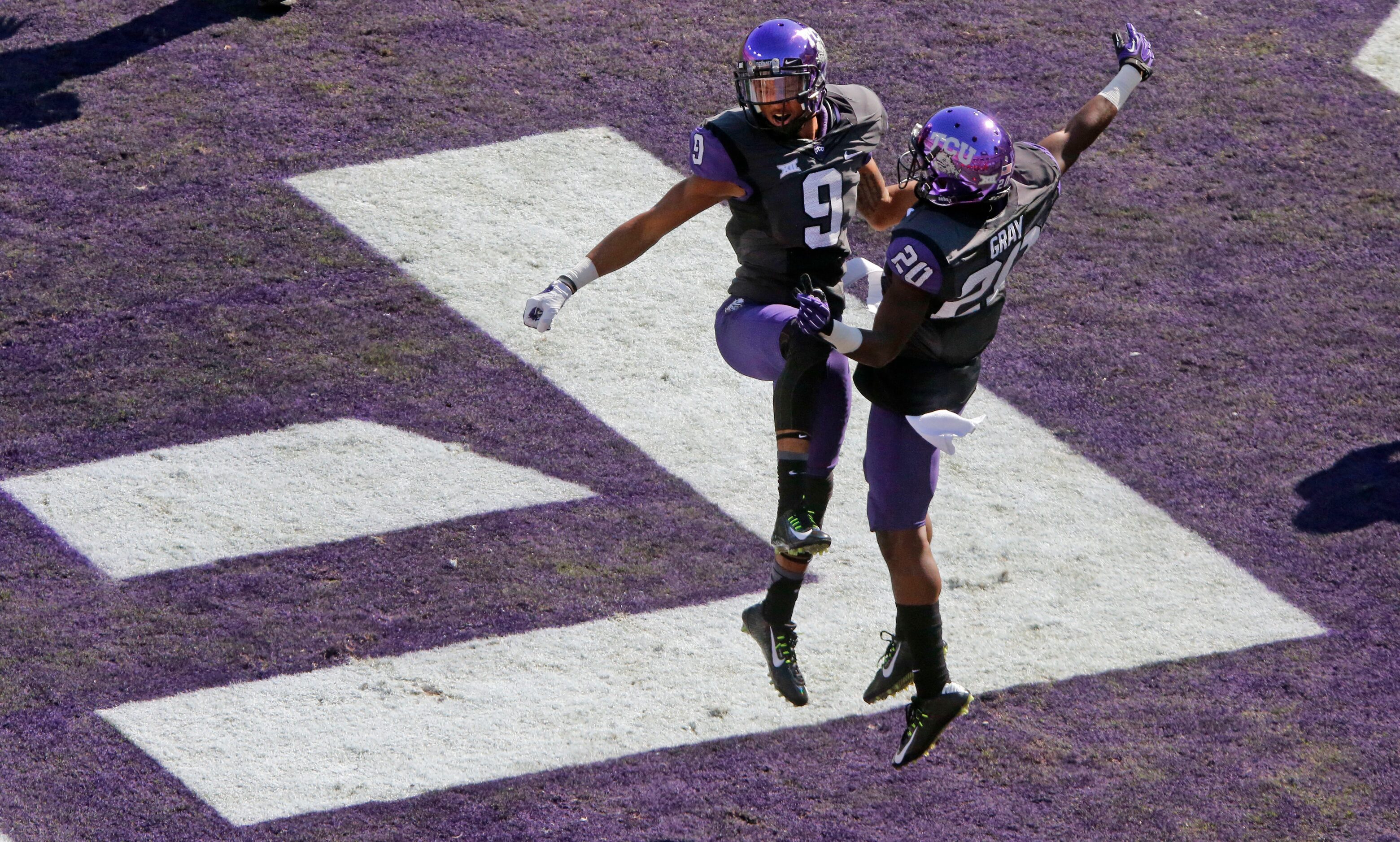 TCU receivers Josh Doctson (9) and Deante' Gray (20) celebrate Doctson's first score of the...