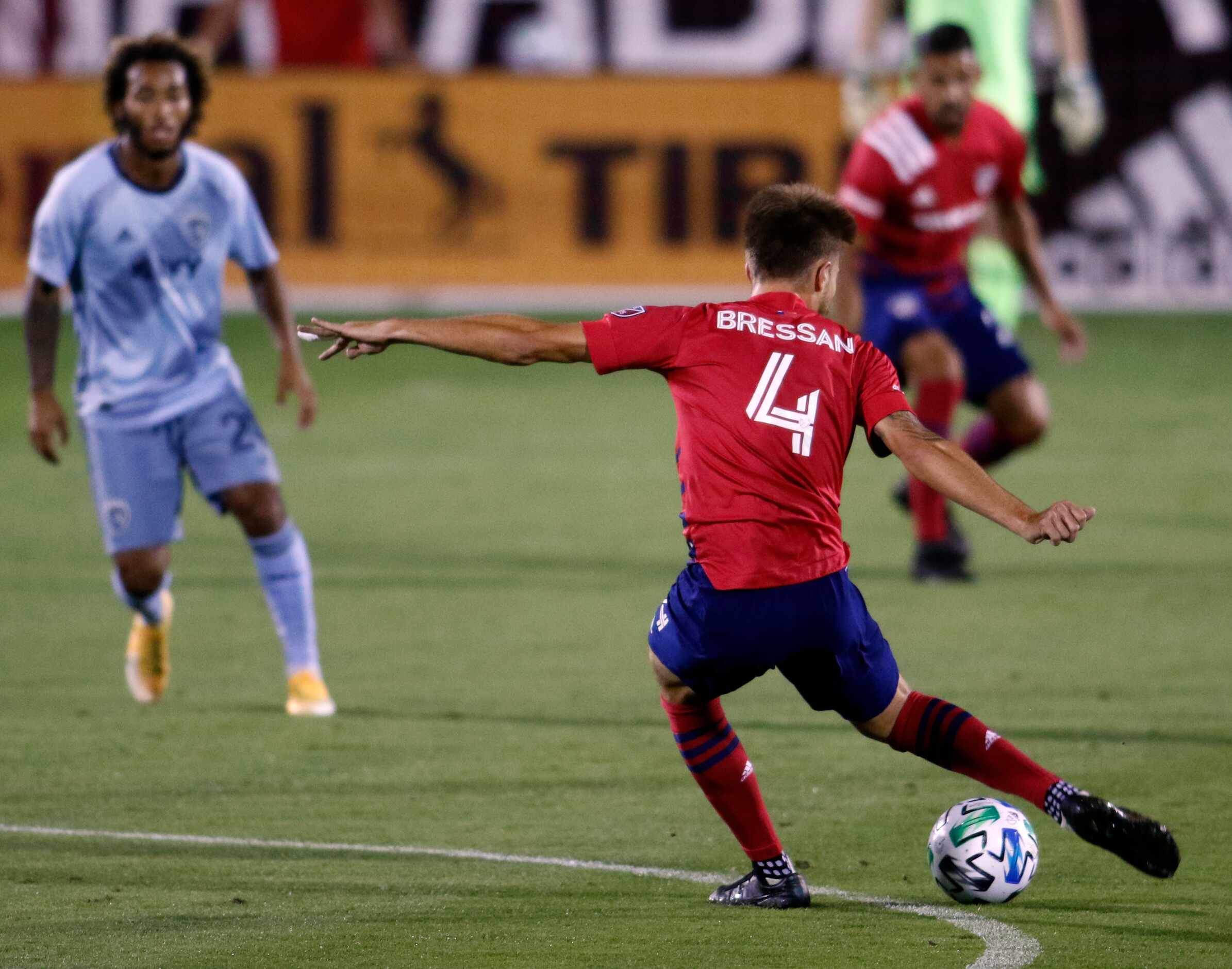 FC Dallas' Bressan (4) works the ball from midfield as he sets up an offensive drive during...