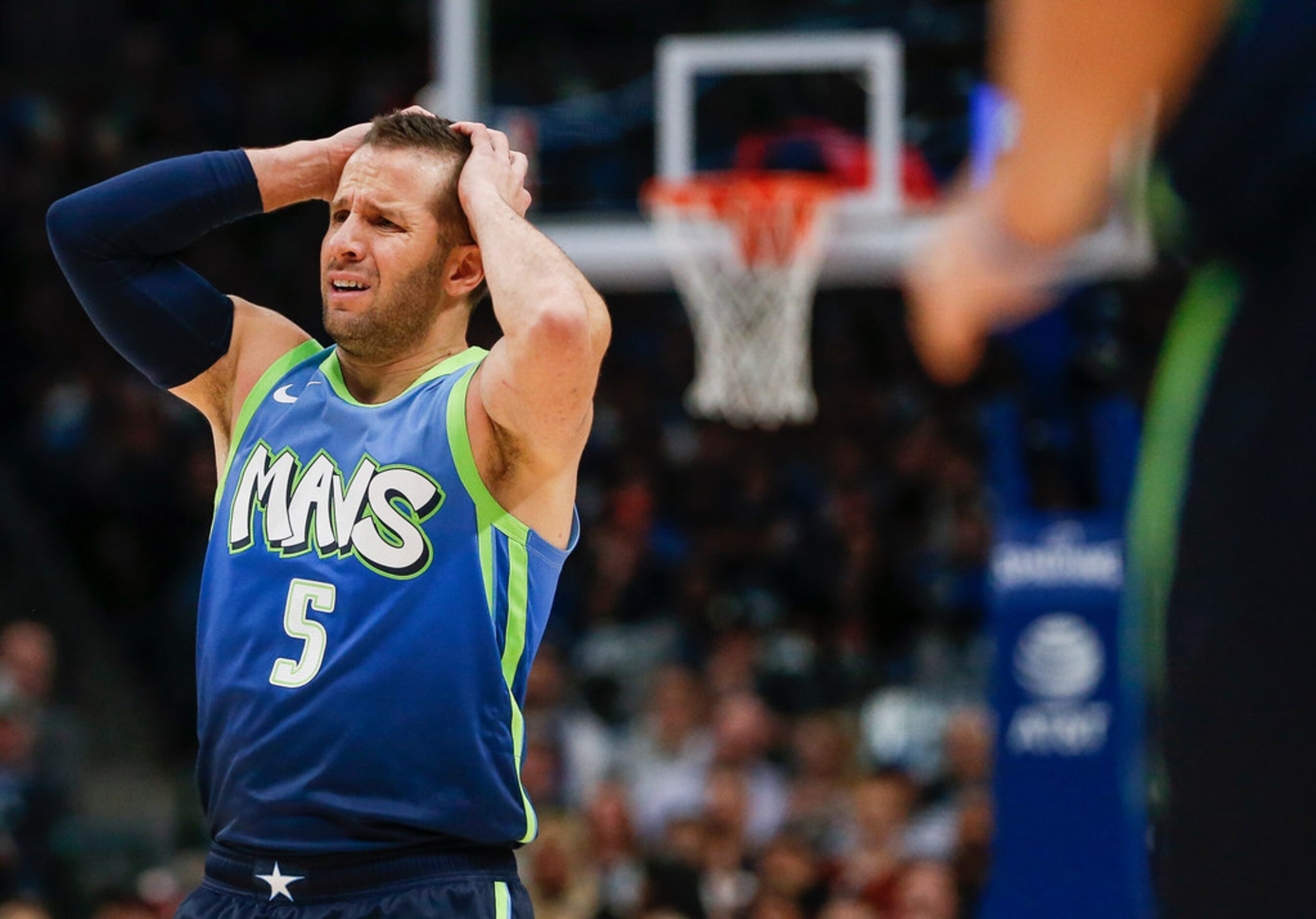 Dallas Mavericks guard J.J. Barea (5) reacts to a play during the first half of a NBA...