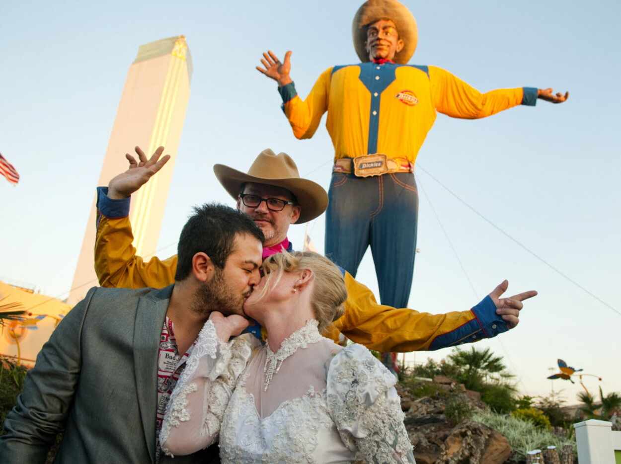 Jose Luis Martinez Hernandez of Mexico City kisses his wife, Sara Rice of Dallas, after...