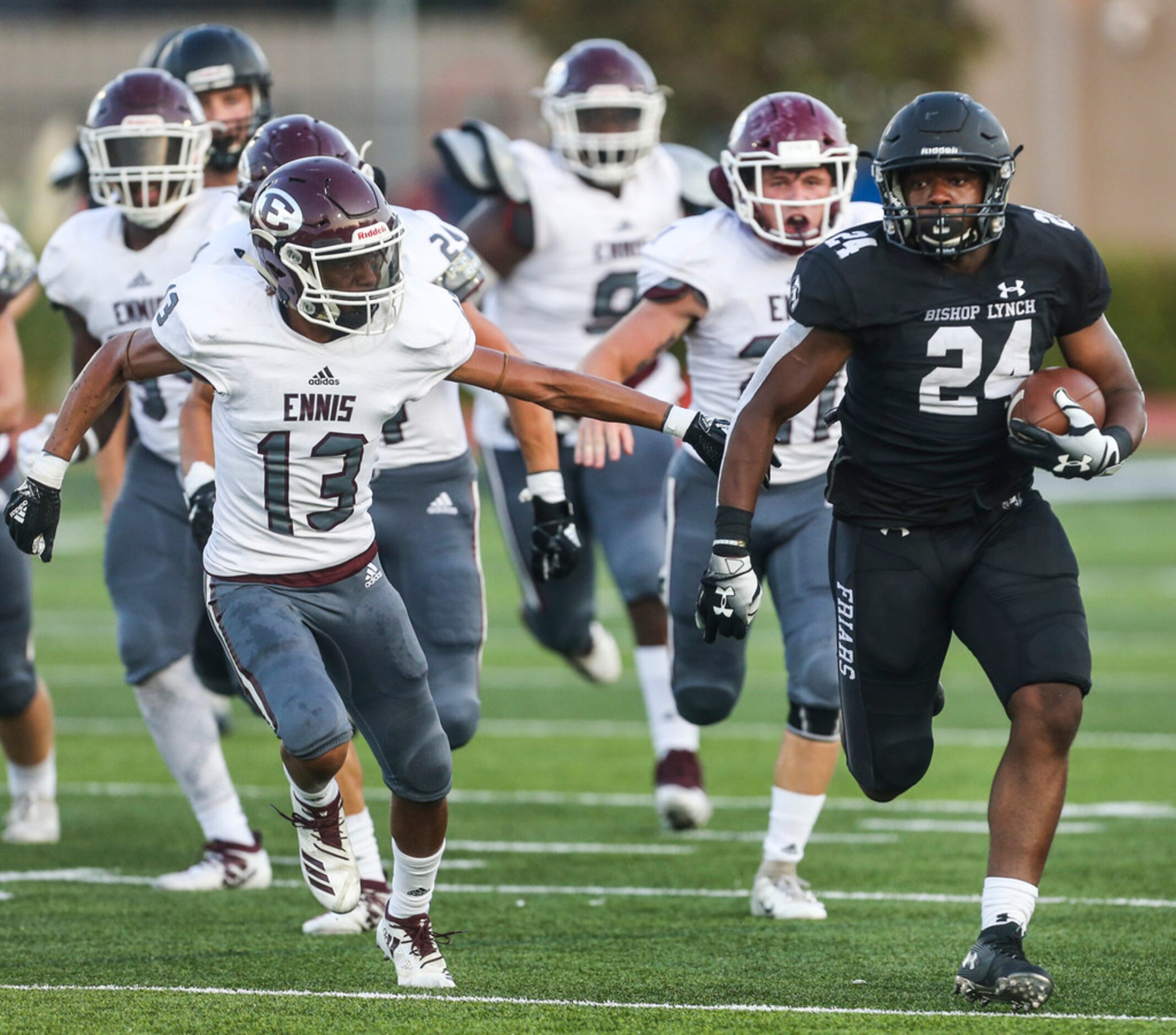 Bishop Lynch running back Darries Boyd (24) makes a run downfield as Ennis defensive back...