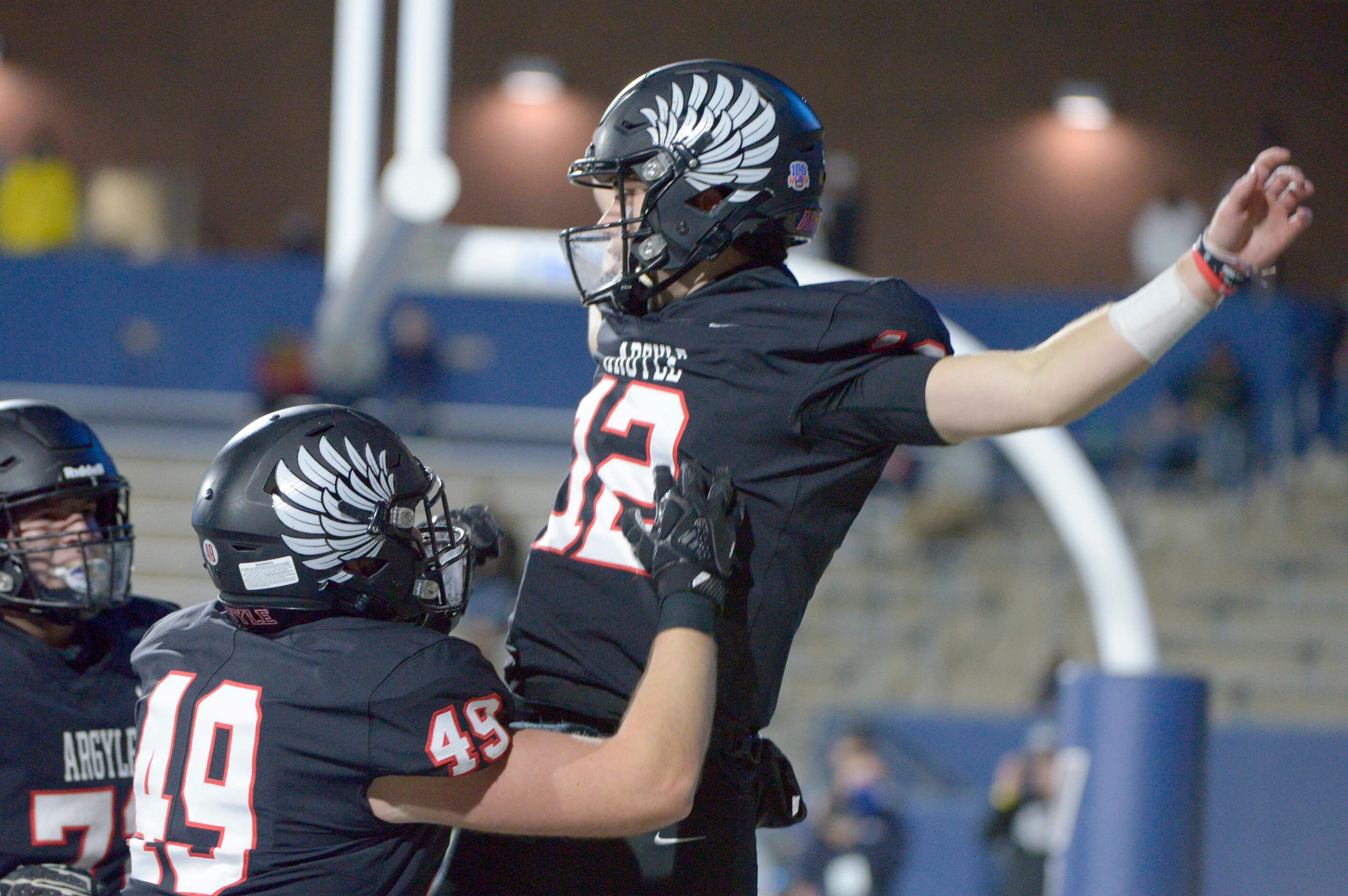 Argyle’s CJ Rogers celebrates his second half touchdown with Grant Chaney (49) during a...
