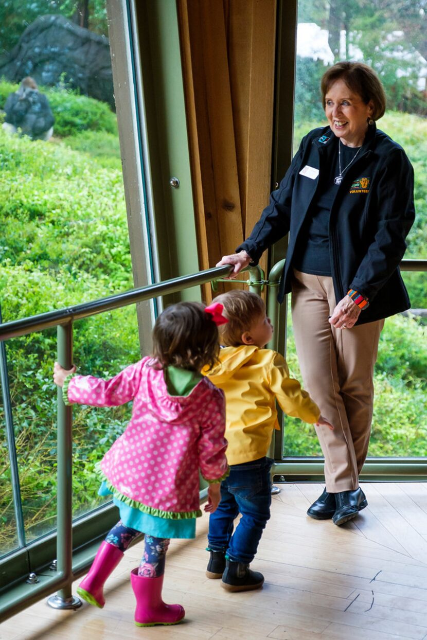 Julie Evans, 73, talks with young guests in the Gorilla Research Station at the Dallas Zoo...