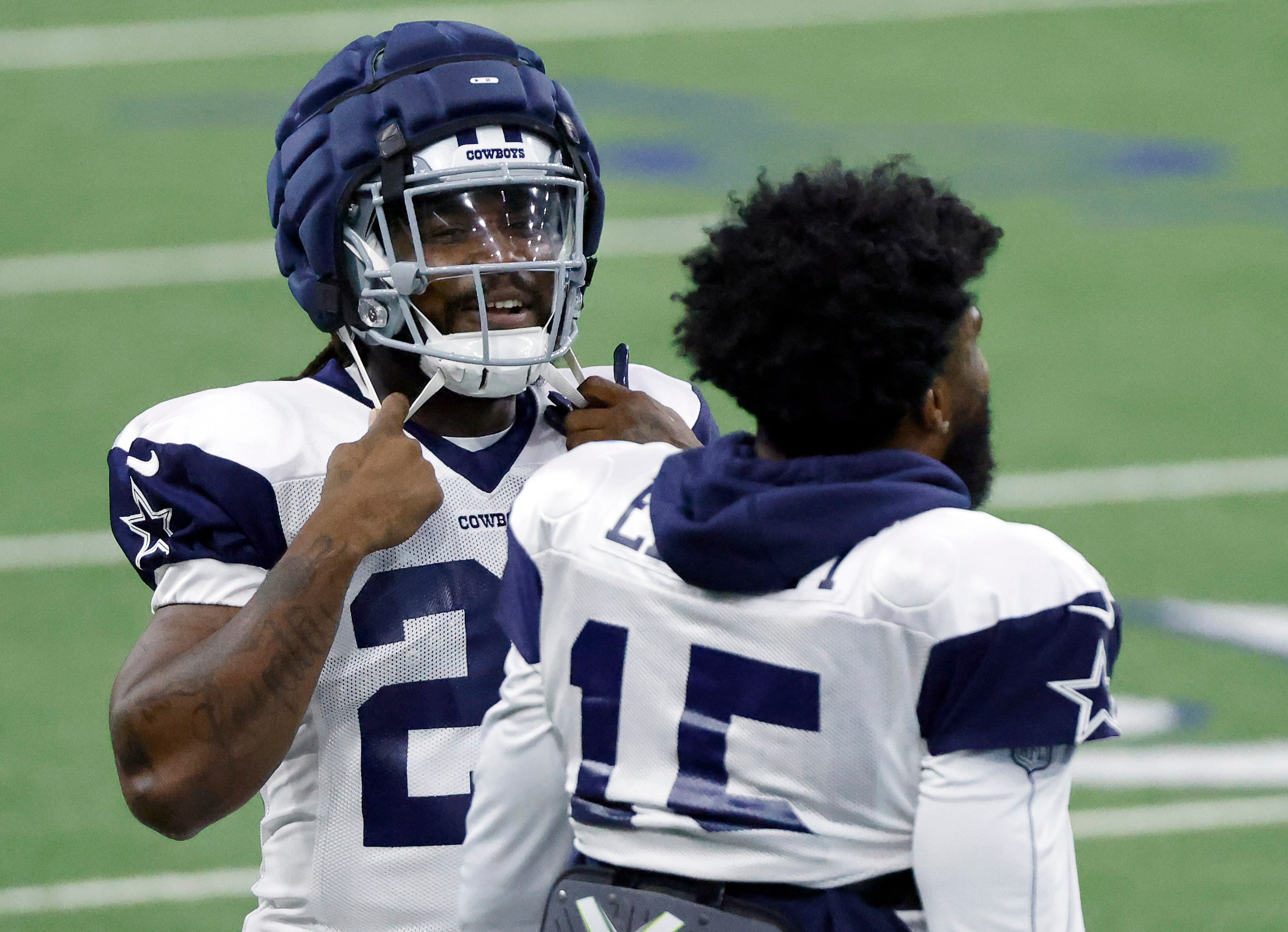 Dallas Cowboys running back Dalvin Cook (20) visits with fellow running back Ezekiel Elliott...