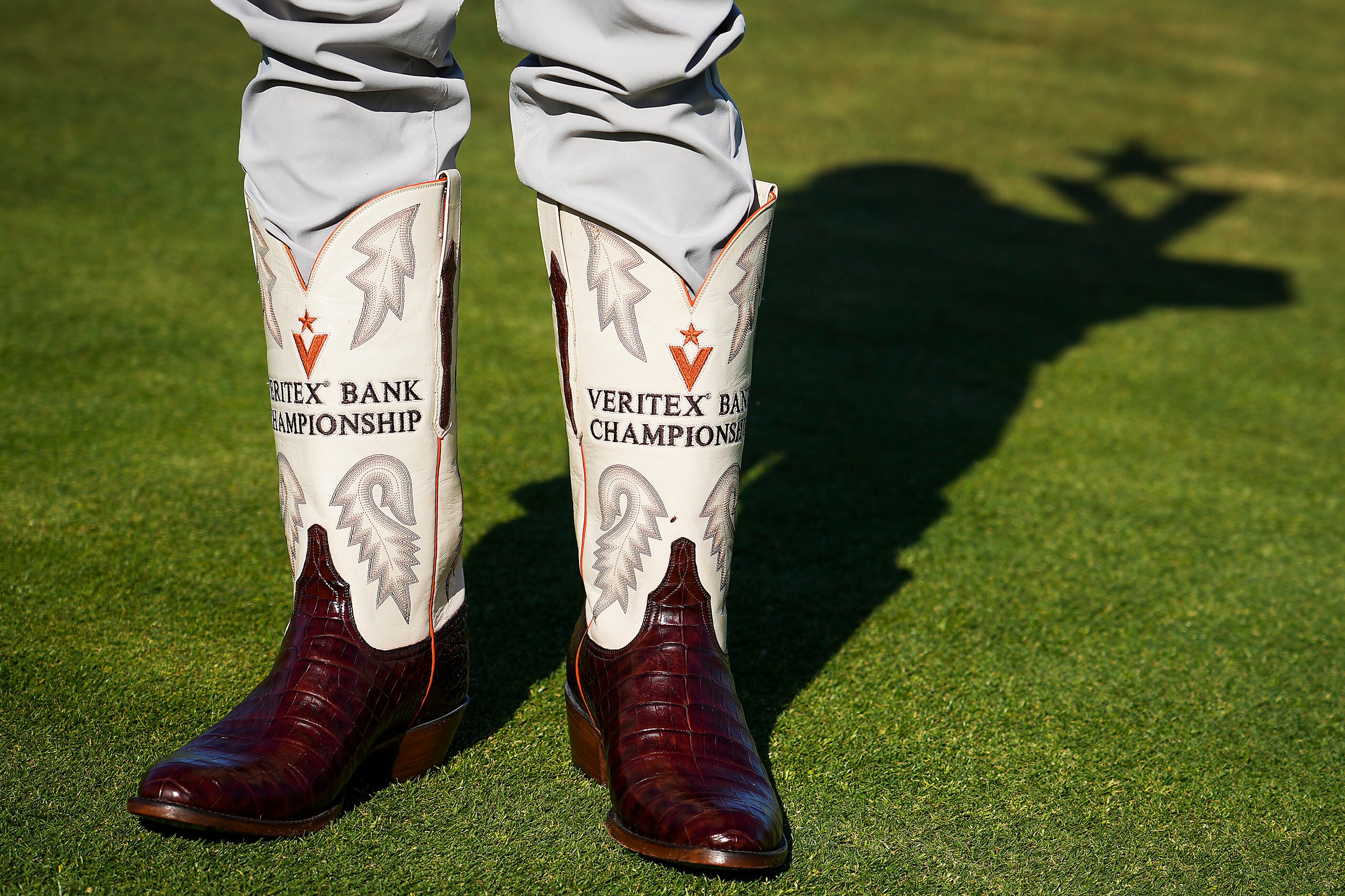 Spencer Levin wears the traditional winner’s cowboy boots after winning the Korn Ferry Tour...