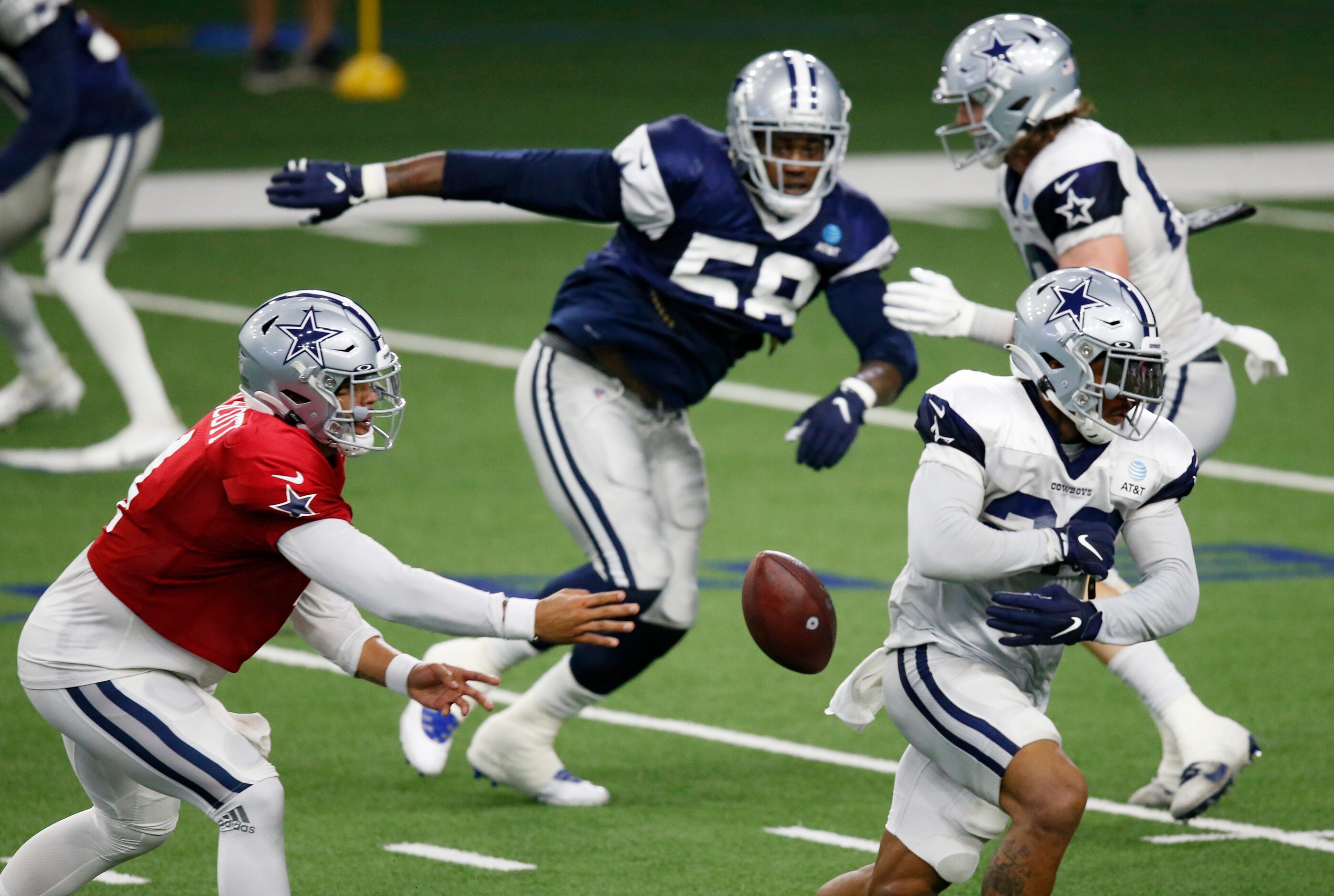 Dallas Cowboys quarterback Dak Prescott (4) and Dallas Cowboys running back Tony Pollard...