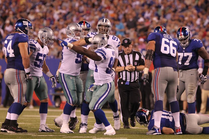 Dallas Cowboys linebacker DeMarcus Ware (94) reacts after sacking New York Giants...