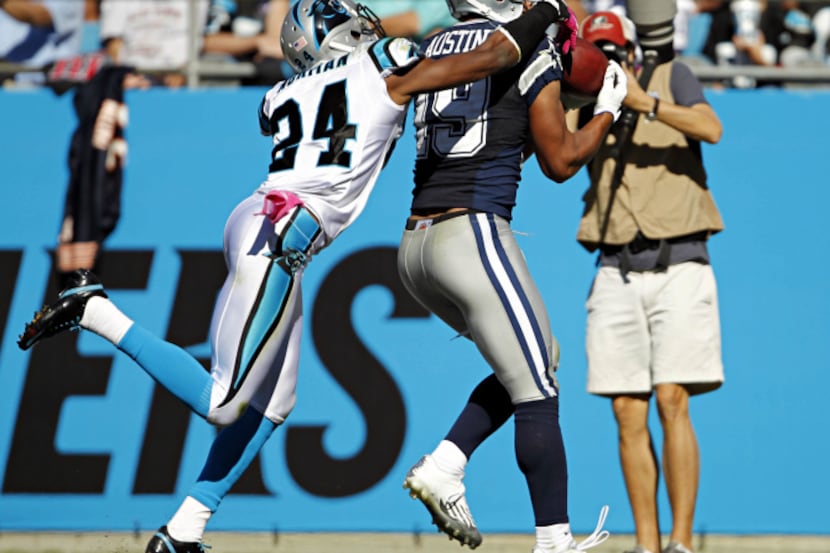 Dallas Cowboys wide receiver Miles Austin (19) stays ahead of Carolina Panthers defensive...
