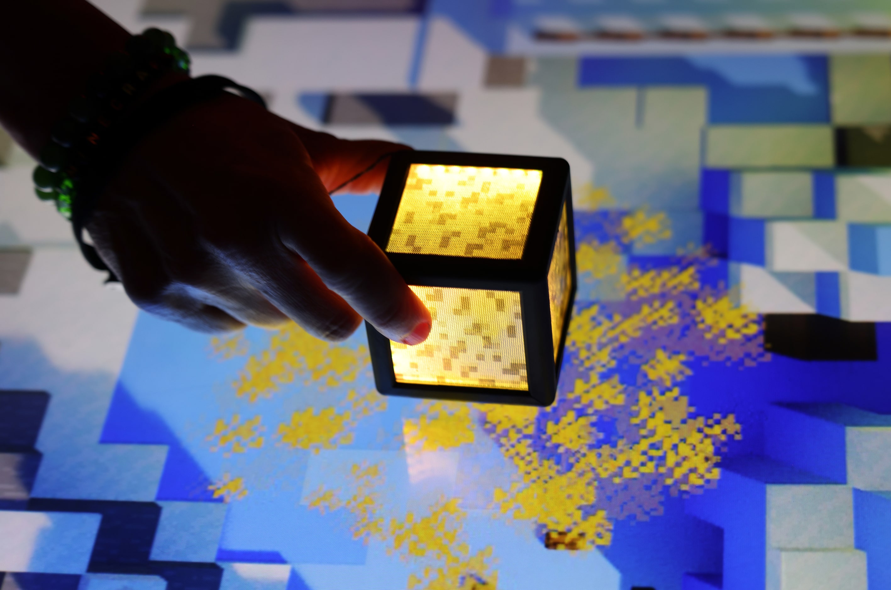 The touch of a cube to the surface activates a burst of colorful designs. Minecraft...