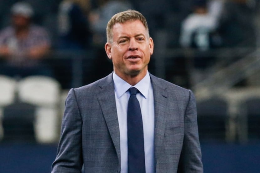 Troy Aikman walks the field prior to an NFL matchup between the Dallas Cowboys and the Los...