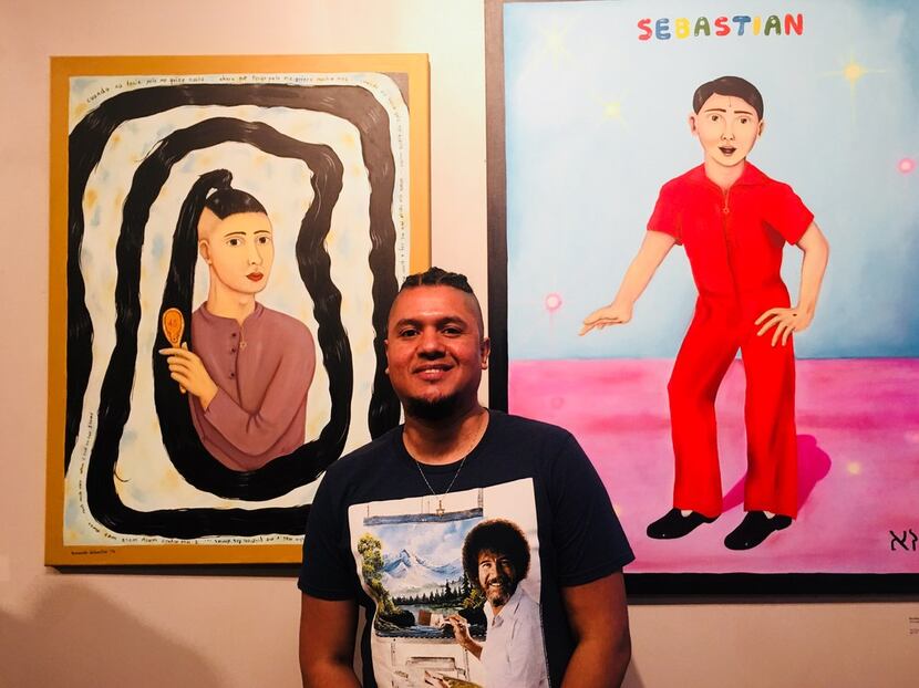 The artist Armando Sebastian poses with his paintings during the art show MaricónX featuring...